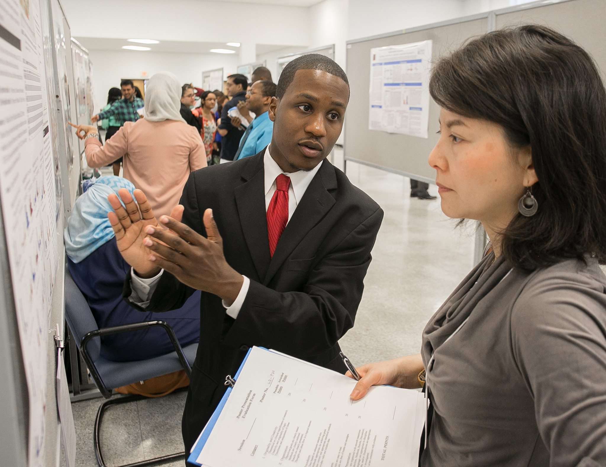 MPA student Tim Walker presents his research poster