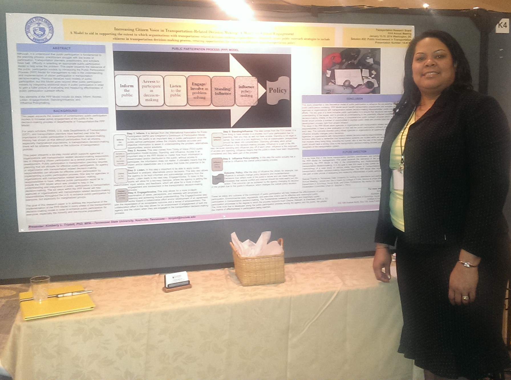 Photo of faculty member at research poster